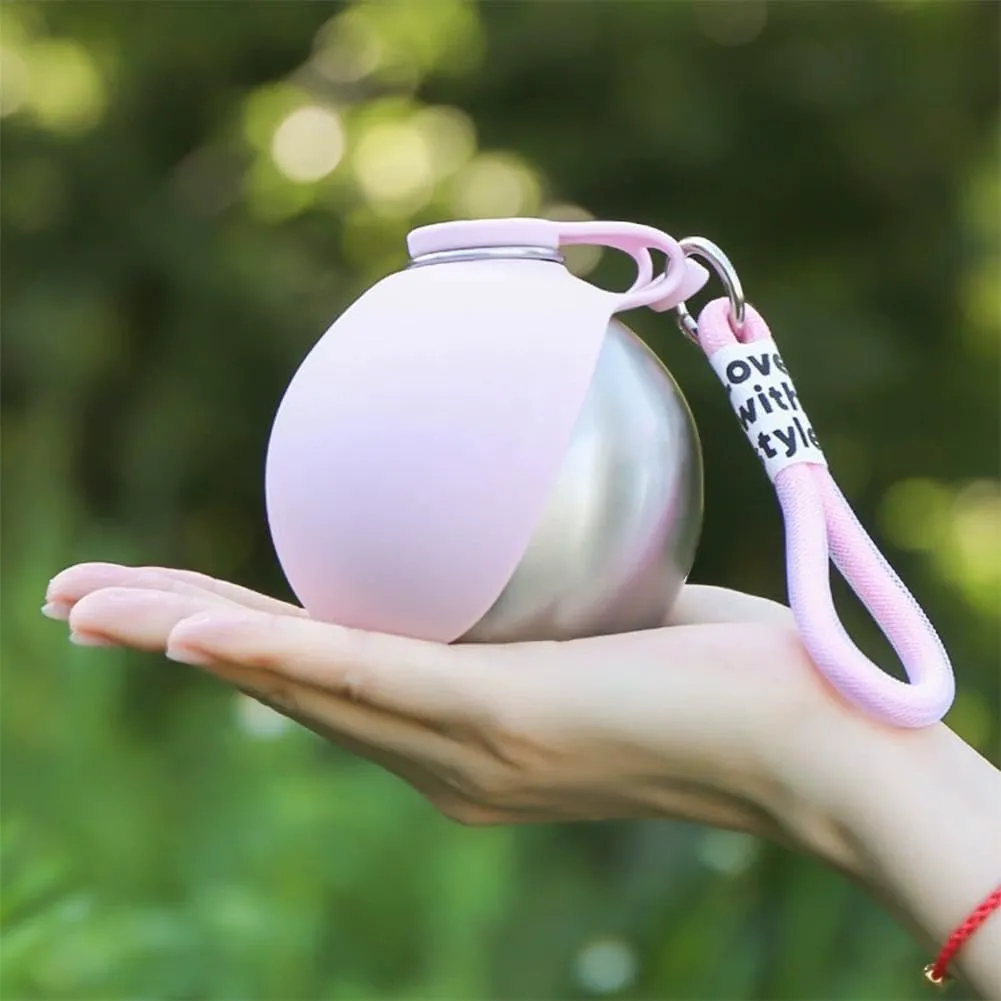 Hand holding compact Dog Water Ball